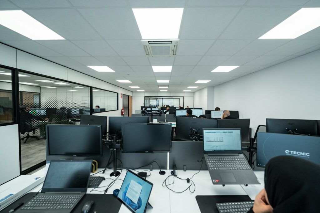 Office space filled with computers and people.